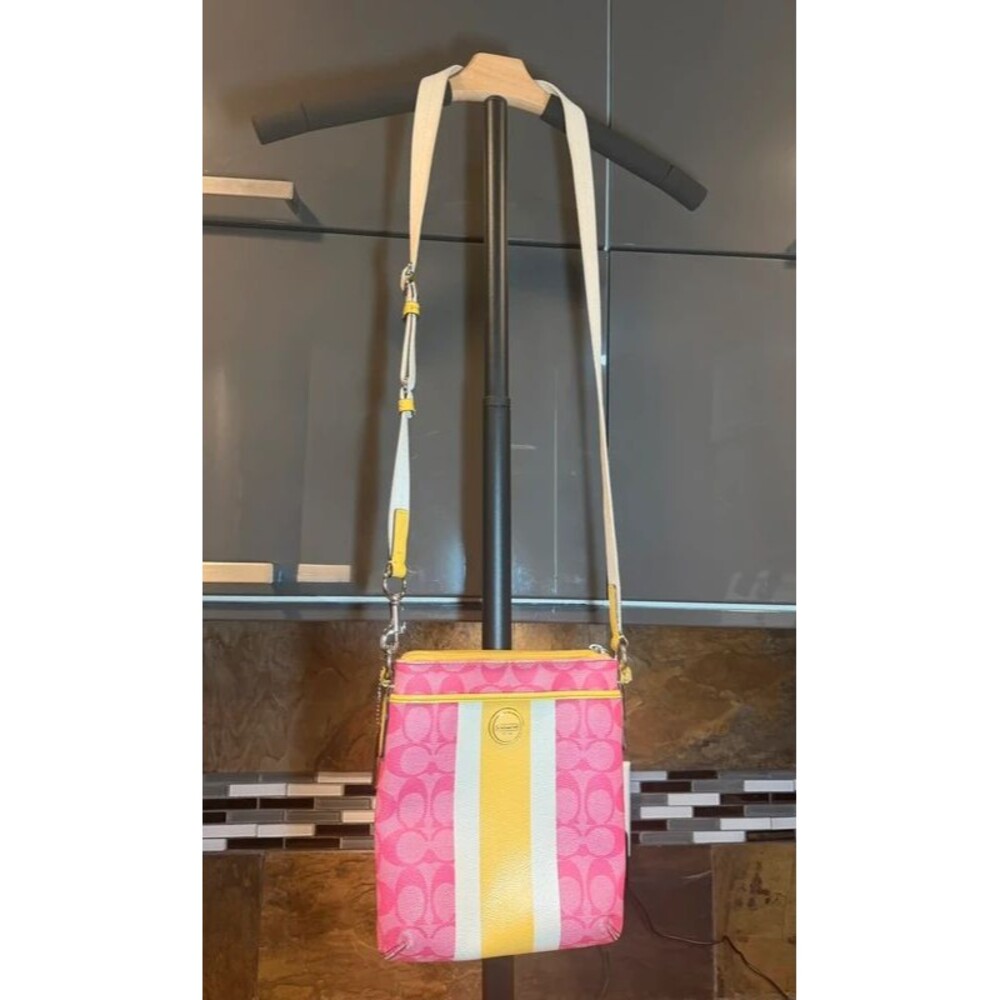 Pink yellow and white Coach Purse fair condition